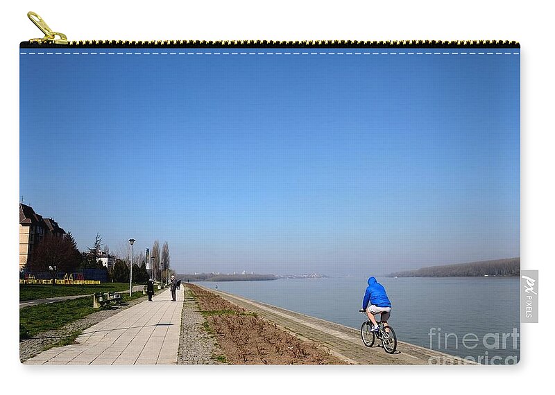 Sava Zip Pouch featuring the photograph Bicyclist and senior couple at bank of Sava River Belgrade Serbia by Imran Ahmed
