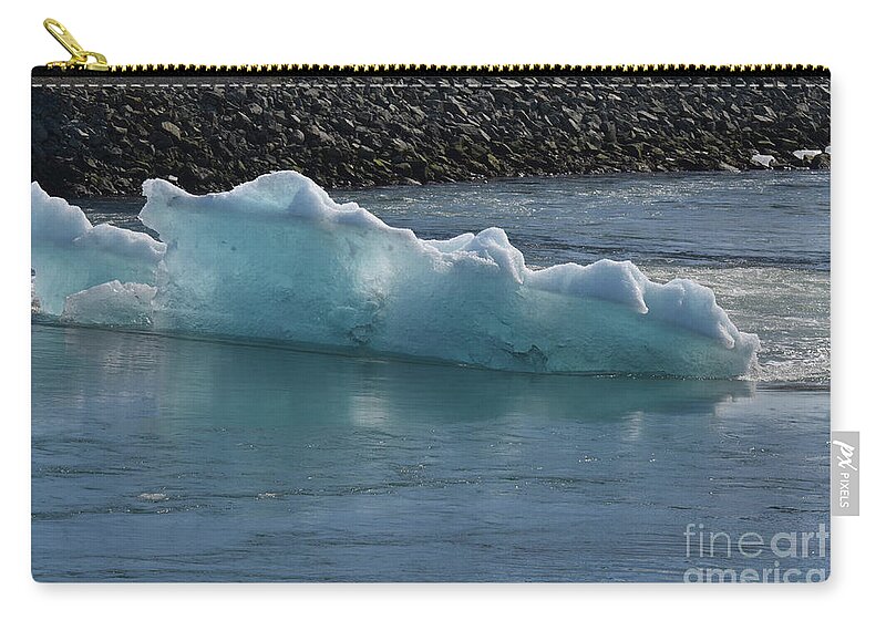 Glacier Zip Pouch featuring the photograph Bluish tint in a icelandic iceburg in a lagoon by DejaVu Designs