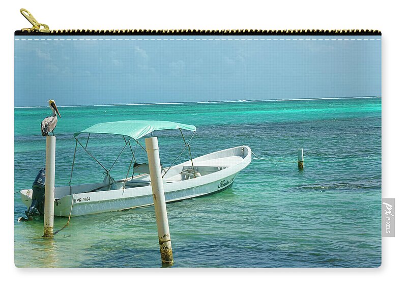 Belize Zip Pouch featuring the photograph Boat and Pelican on Ambergris Caye Belize by Waterdancer