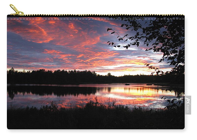 Sunset Zip Pouch featuring the photograph Brilliant Sunset framed by tree by Anthony Trillo