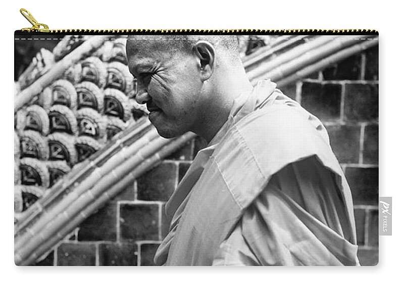 Monastry Zip Pouch featuring the photograph Buddhist Monk by Aleck Cartwright