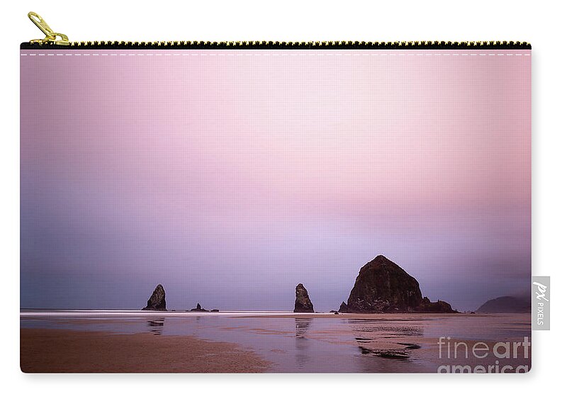 Nature Zip Pouch featuring the photograph Cannon beach in the early morning blue light by Paul Quinn