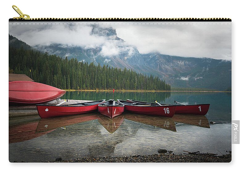 British Columbia Zip Pouch featuring the photograph Canoes at Emerald Lake by James Udall