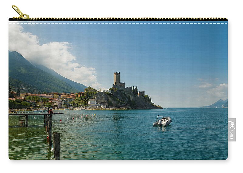 Lake Zip Pouch featuring the photograph Castle of Malcesine, view from the beach by Nicola Aristolao