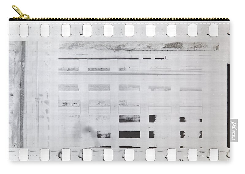 Film Zip Pouch featuring the photograph Celluloid film by Michal Boubin