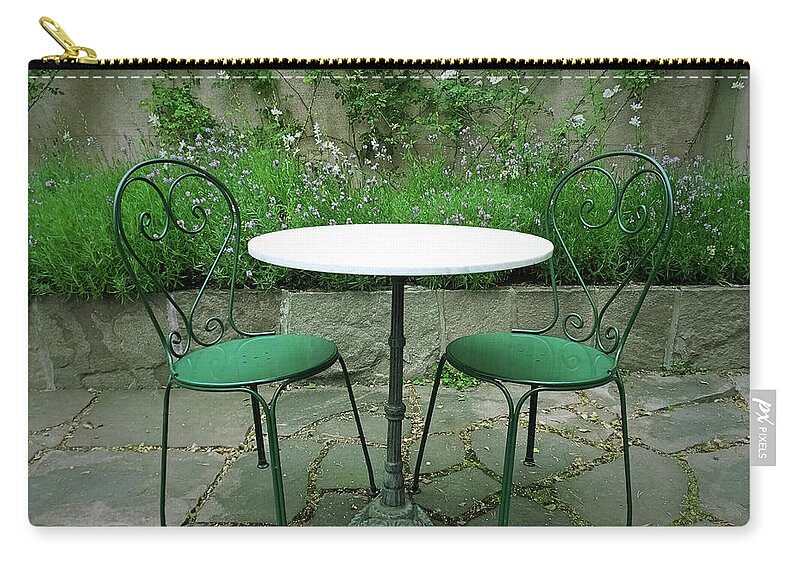 Chair Zip Pouch featuring the photograph Chairs and table in a magic summer garden by GoodMood Art