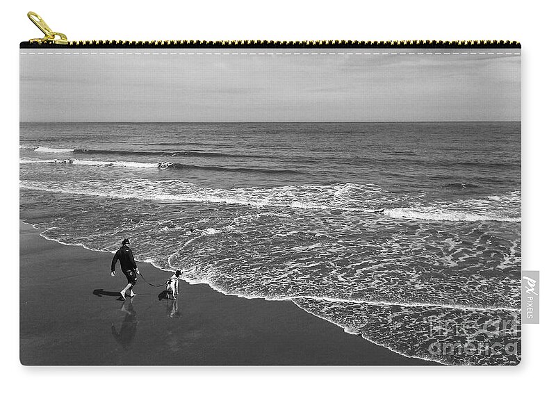 The North Sea Zip Pouch featuring the photograph Chasing The Tide in Black and White by Joan-Violet Stretch
