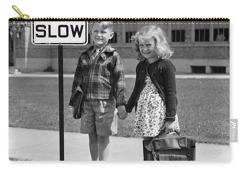 1930s Zip Pouch featuring the photograph Children Next To Slow Traffic Sign by H. Armstrong Roberts/ClassicStock