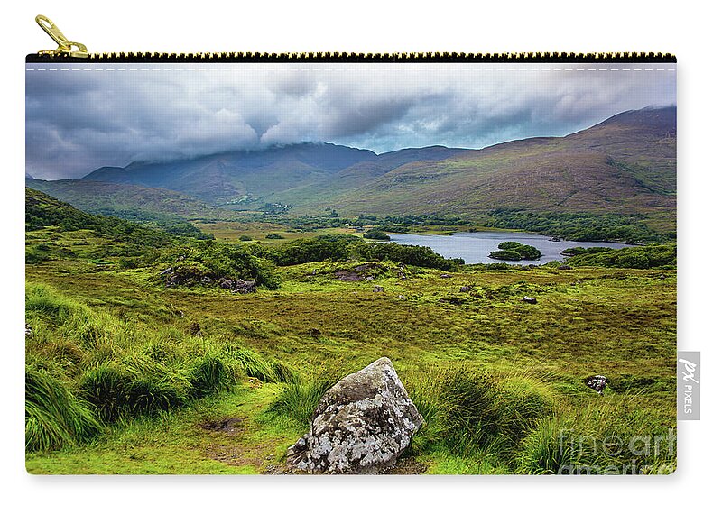 Ireland Zip Pouch featuring the photograph Cloudy Hills and Lake in Ireland by Andreas Berthold