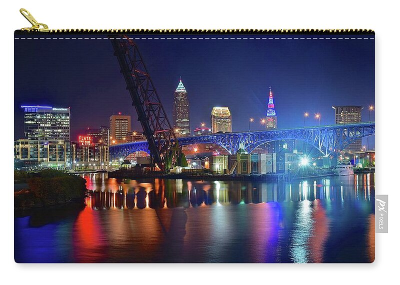 Cleveland Zip Pouch featuring the photograph Colorful Cleveland Lights Shimmer Bright by Frozen in Time Fine Art Photography