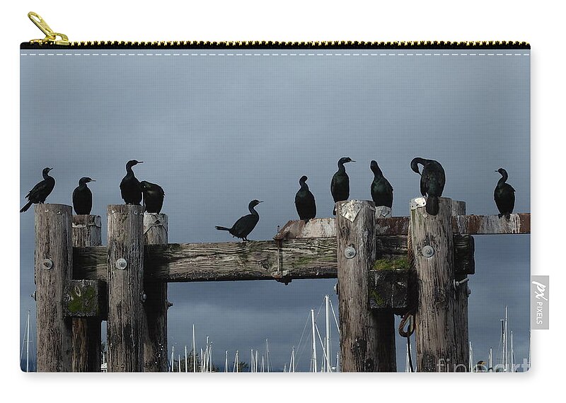 Cormorants Birds Sky Clouds Drama Boats Seaside Sun Shadow Light Pilings Bolts Wood Logs Grey Blue Black White Brown Yellow White Carry-all Pouch featuring the photograph Cormorants by Ida Eriksen