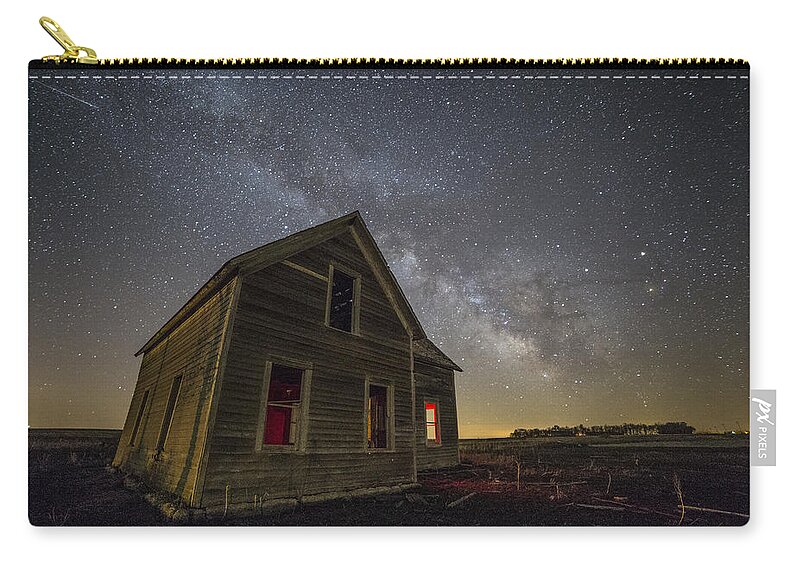 Howard Zip Pouch featuring the photograph Dark Place with meteor by Aaron J Groen