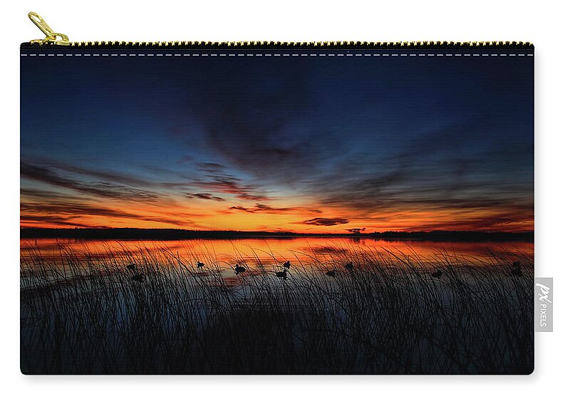 Hunt Zip Pouch featuring the photograph Dawn on Thunder Lake by Dale Kauzlaric