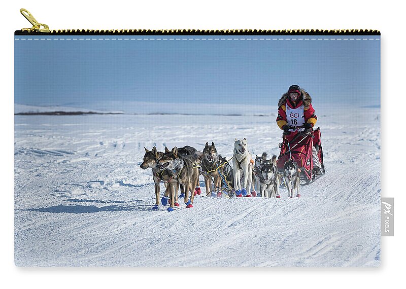 Alaska Zip Pouch featuring the photograph Dog Team on Iditarod Trail by Scott Slone