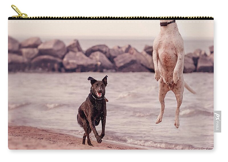 Action Carry-all Pouch featuring the photograph Dog with frisbee by Peter Lakomy