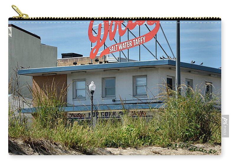 Dolles Zip Pouch featuring the photograph Dolles from the Beach - Rehoboth Beach Delaware by Brendan Reals