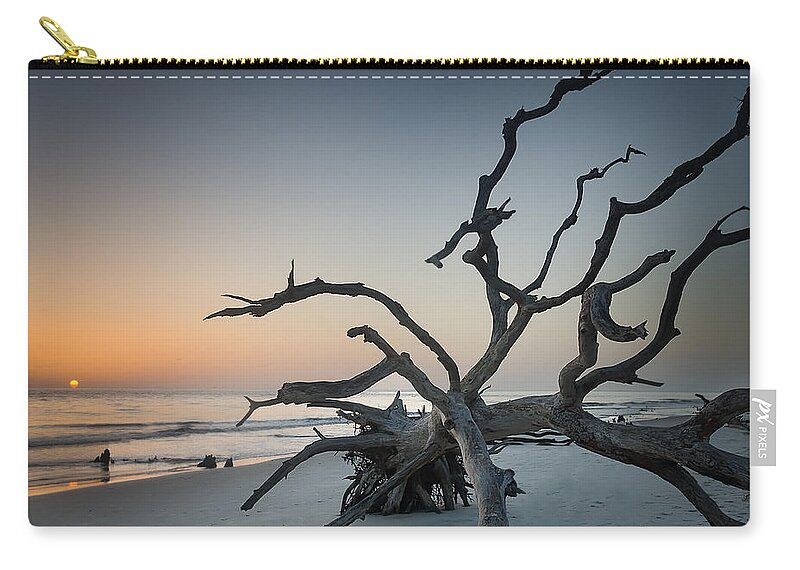 Sunrise Zip Pouch featuring the photograph Driftwood Sunrise by John Kirkland