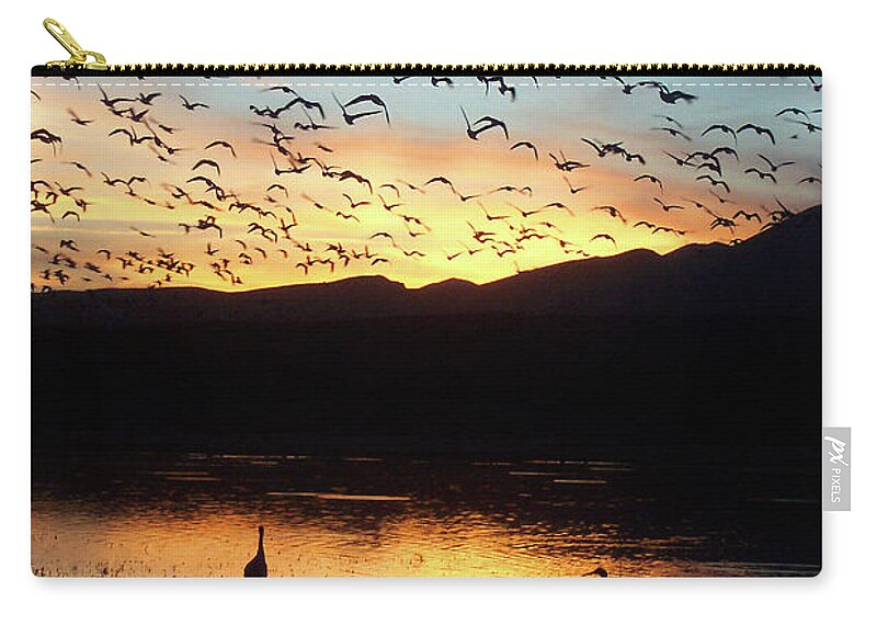 Water Zip Pouch featuring the photograph Dusk at Bosque del Apache by Jerry Griffin
