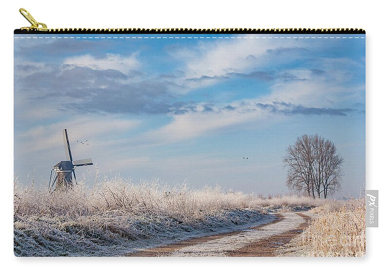 Holland Zip Pouch featuring the photograph Dutch windmill in winter by Casper Cammeraat