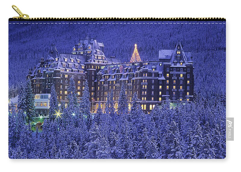 Banff Springs Hotel Zip Pouch featuring the photograph D.wiggett Banff Springs Hotel In Winter by First Light