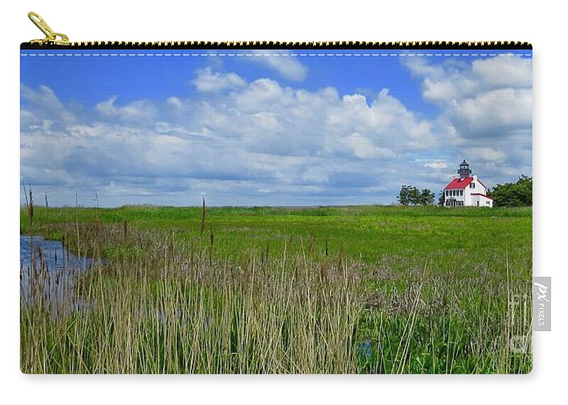East Point Lighthouse Zip Pouch featuring the photograph East Point Lighthouse Across the Marsh by Nancy Patterson