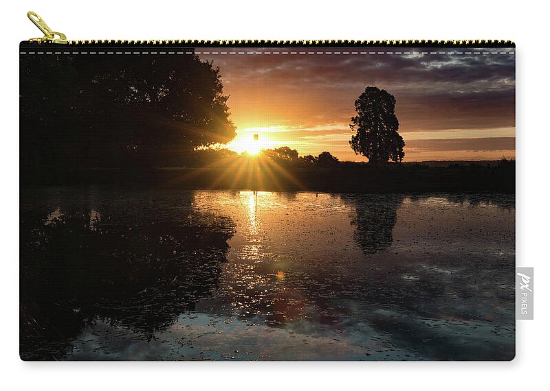 Sunrise Zip Pouch featuring the photograph Essex sunrise by Roger Lighterness