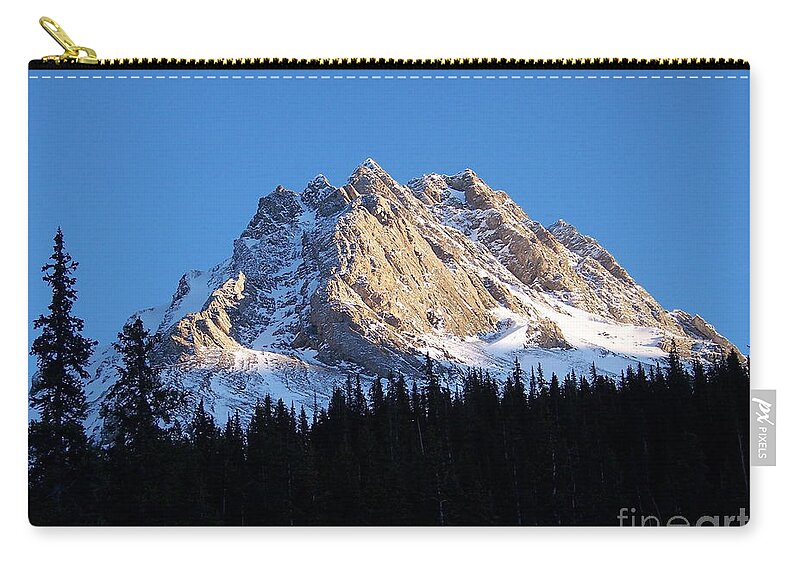 Scenic Zip Pouch featuring the photograph Fading Afternoon Sun Illuminates Mountain Peak by Greg Hammond
