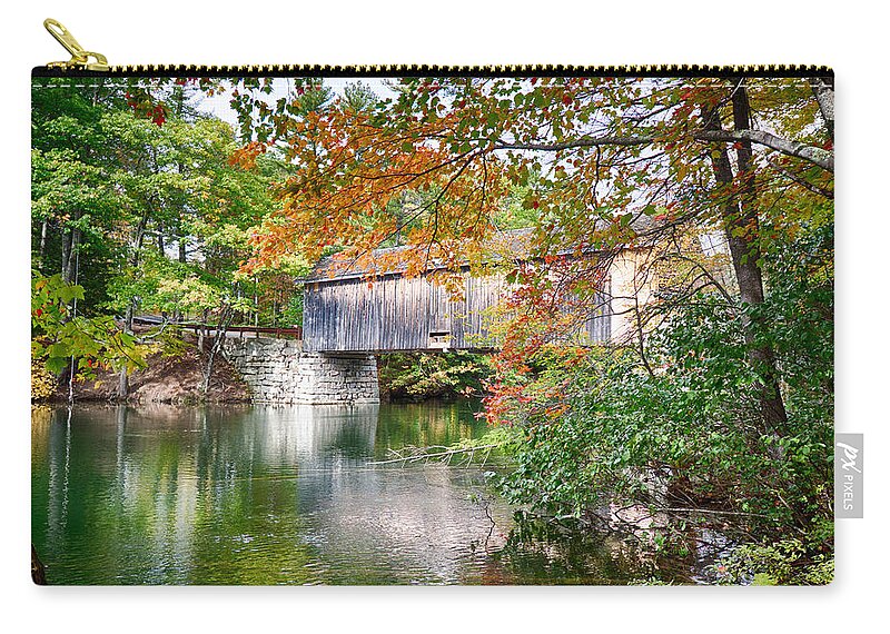Autumn Foliage New England Zip Pouch featuring the photograph Fall colors over the Babs covered bridge by Jeff Folger