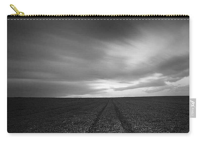Field Zip Pouch featuring the photograph Field and cloudy sky by Michalakis Ppalis