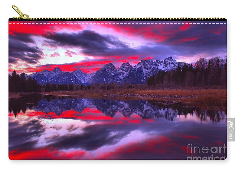 Grand Teton National Park Zip Pouch featuring the photograph Fiery Pink And Purple Teton Skies by Adam Jewell