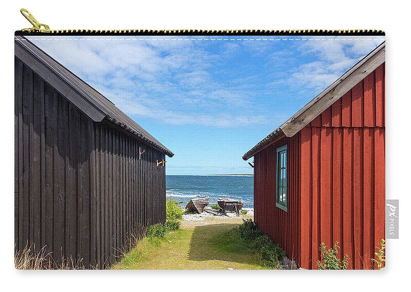 Sea Zip Pouch featuring the photograph Fishing village on Faro island, Sweden by GoodMood Art