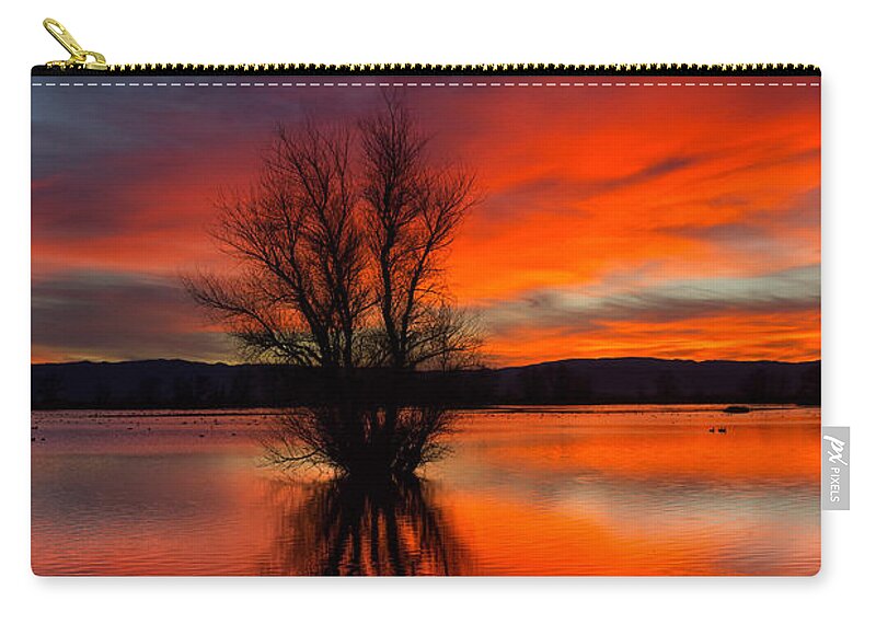 Red Zip Pouch featuring the photograph Flames on the Water by Kathleen Bishop