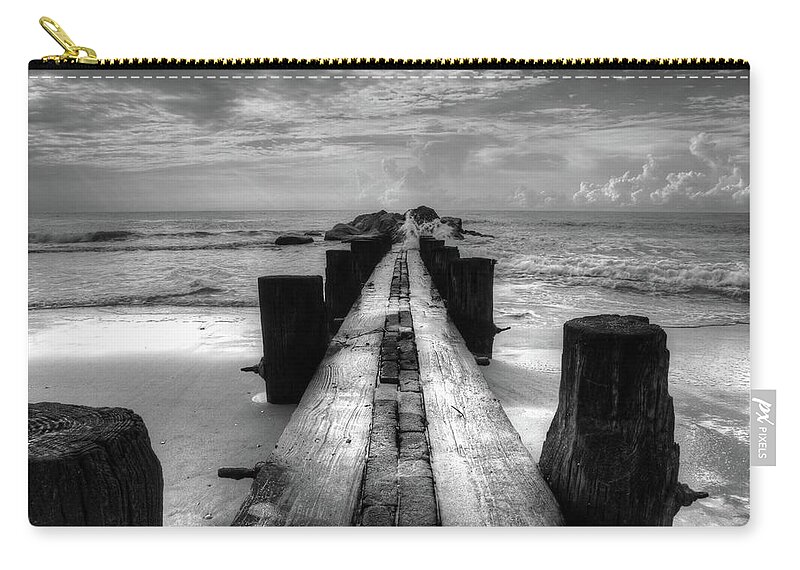 Folly Beach Pilings Carry-all Pouch featuring the photograph Folly Beach Pilings Charleston South Carolina In Black and White by Carol Montoya