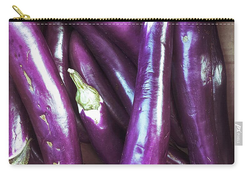 Agriculture Zip Pouch featuring the photograph Fresh purple aubergines by Tom Gowanlock