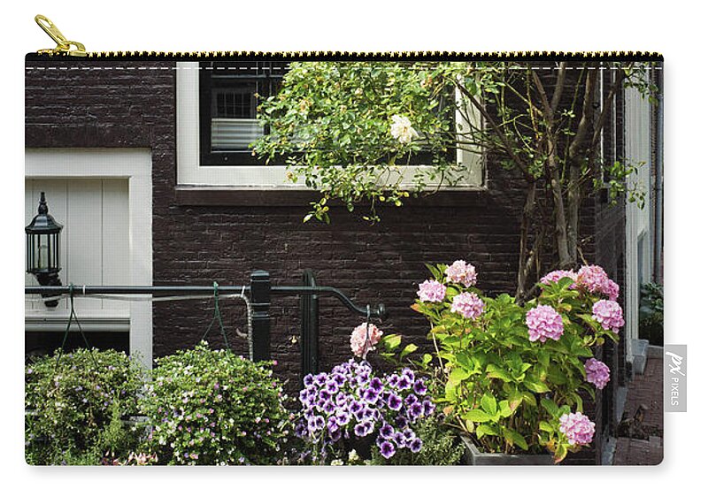 Amsterdam Zip Pouch featuring the photograph Garden in the City by Rebekah Zivicki