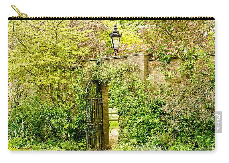 Garden Wall Zip Pouch featuring the photograph Garden Wall With Iron Gate And Lantern. by Elena Perelman