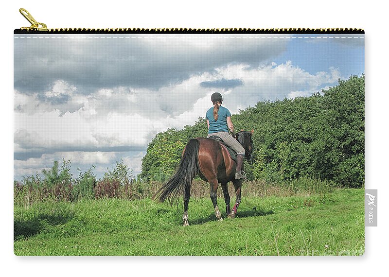 Animal Zip Pouch featuring the photograph Girl riding horse by Patricia Hofmeester