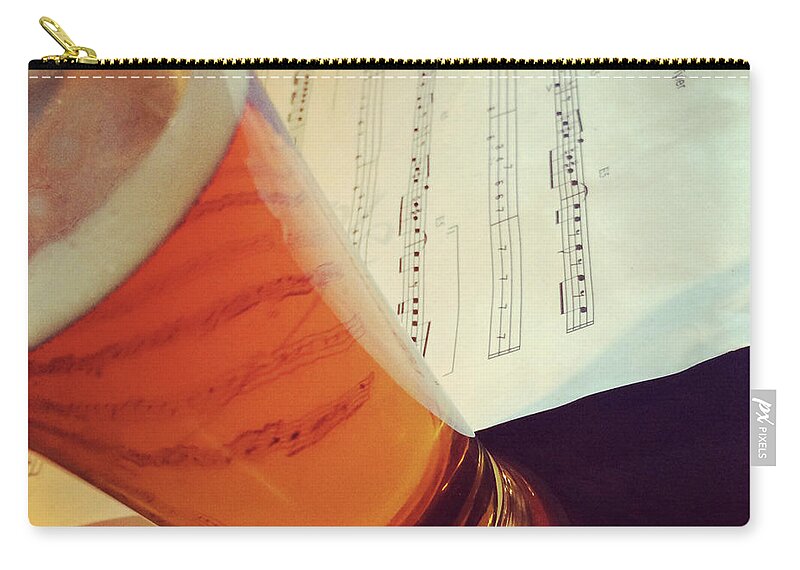 Beer Zip Pouch featuring the photograph Glass of beer and music notes by GoodMood Art