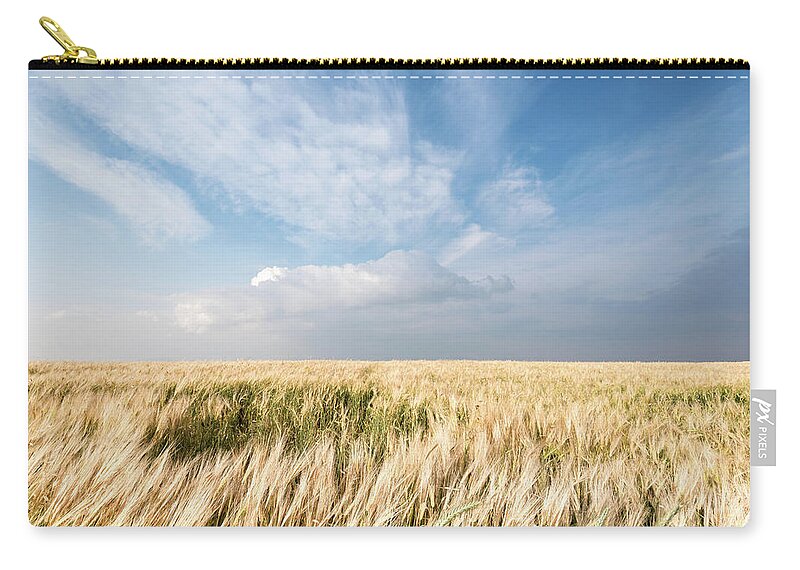 Wheat Field Zip Pouch featuring the photograph Golden wheat field and sky by Michalakis Ppalis