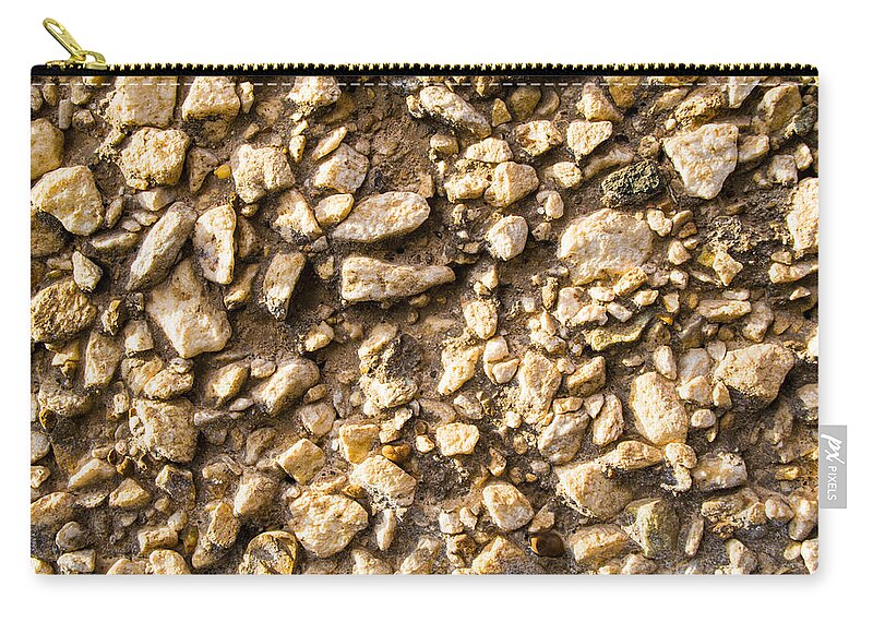 Stone Gravel Zip Pouch featuring the photograph Gravel stones on a wall by John Williams