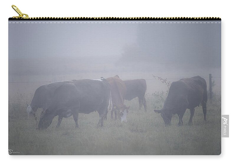 Cows Zip Pouch featuring the photograph Grazing cows in the mist by Torbjorn Swenelius