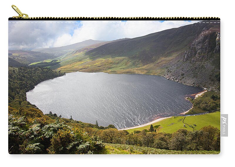 Clouds Zip Pouch featuring the photograph Guinness Lake in Wicklow Mountains Ireland by Semmick Photo