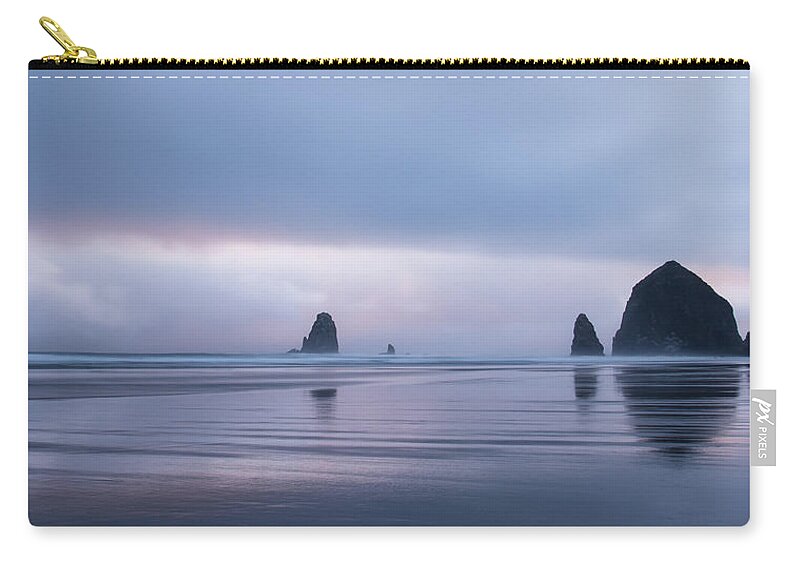Cannon Beach Zip Pouch featuring the photograph Haystack and the Needles by Don Schwartz