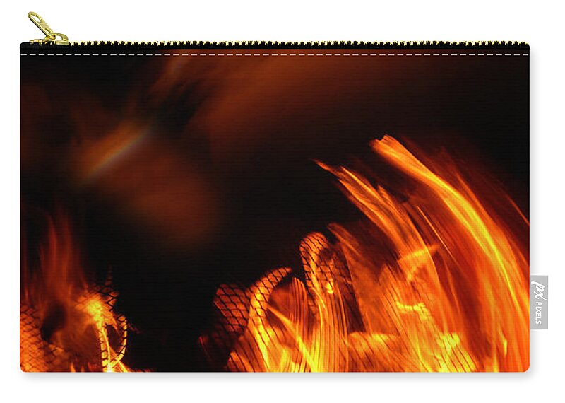 Fire Zip Pouch featuring the photograph Heavenly Flame by Donna Blackhall