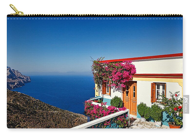 House Zip Pouch featuring the photograph House of the village Olympos in Karpathos - Greece by Constantinos Iliopoulos