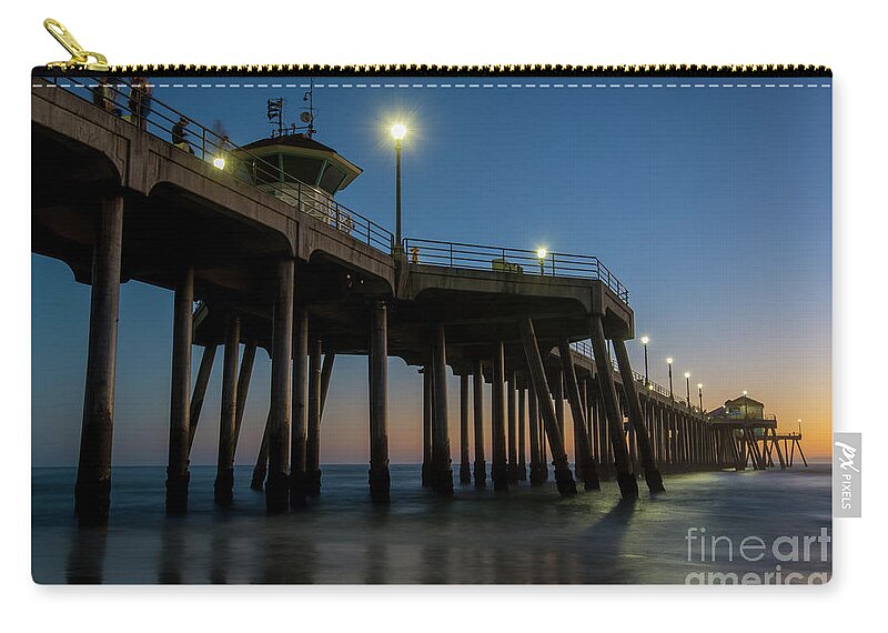 Huntington Beach Zip Pouch featuring the photograph Huntington Beach pier at dusk by Paul Quinn