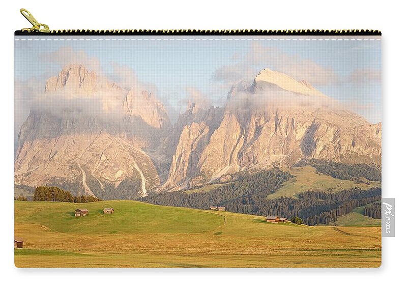 Alpe Di Siusi Zip Pouch featuring the photograph Huts on the Alpe di Siusi by Stephen Taylor