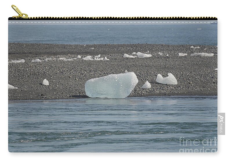 Glacier Zip Pouch featuring the photograph Iceland iceberg on the shore of a lagoon by DejaVu Designs