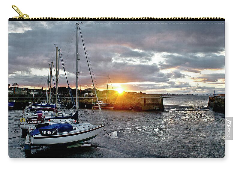 Sunset Zip Pouch featuring the photograph In the rays of the setting sun. by Elena Perelman