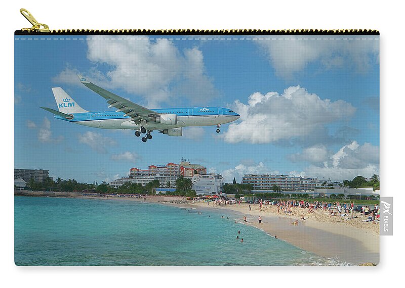 Klm Zip Pouch featuring the photograph K L M at St. Maarten Airport by David Gleeson